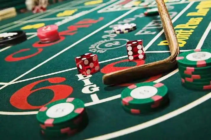 Live roulette table interface on mobile phone displaying spinning wheel and betting layout